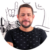 Round picture of Carlos Wanderlan, CTO of Hand Talk. It shhows his head, smiling. He is a white man with brown short hair, has a mustache and a beard, and is wearing a navy black shirt. 